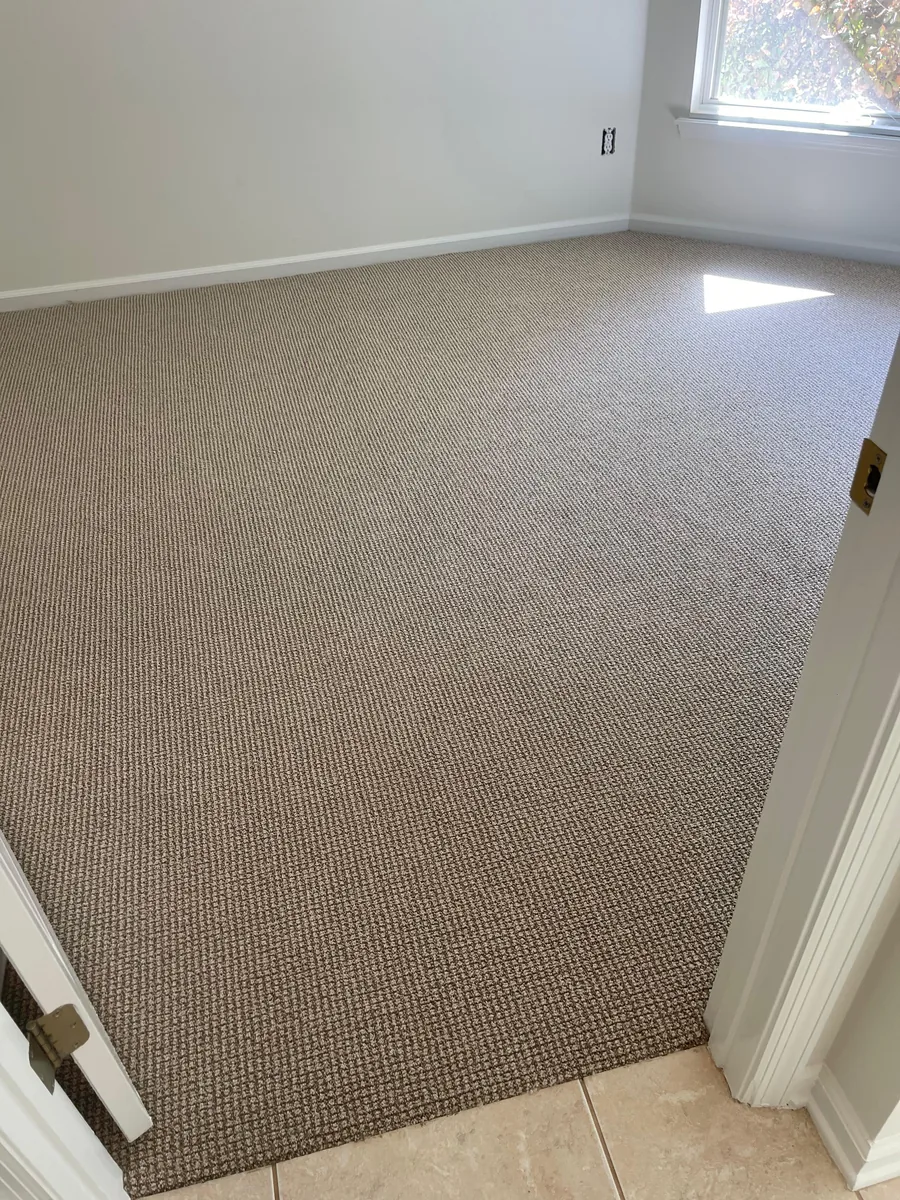 Berber loop carpet installed in a bedroom