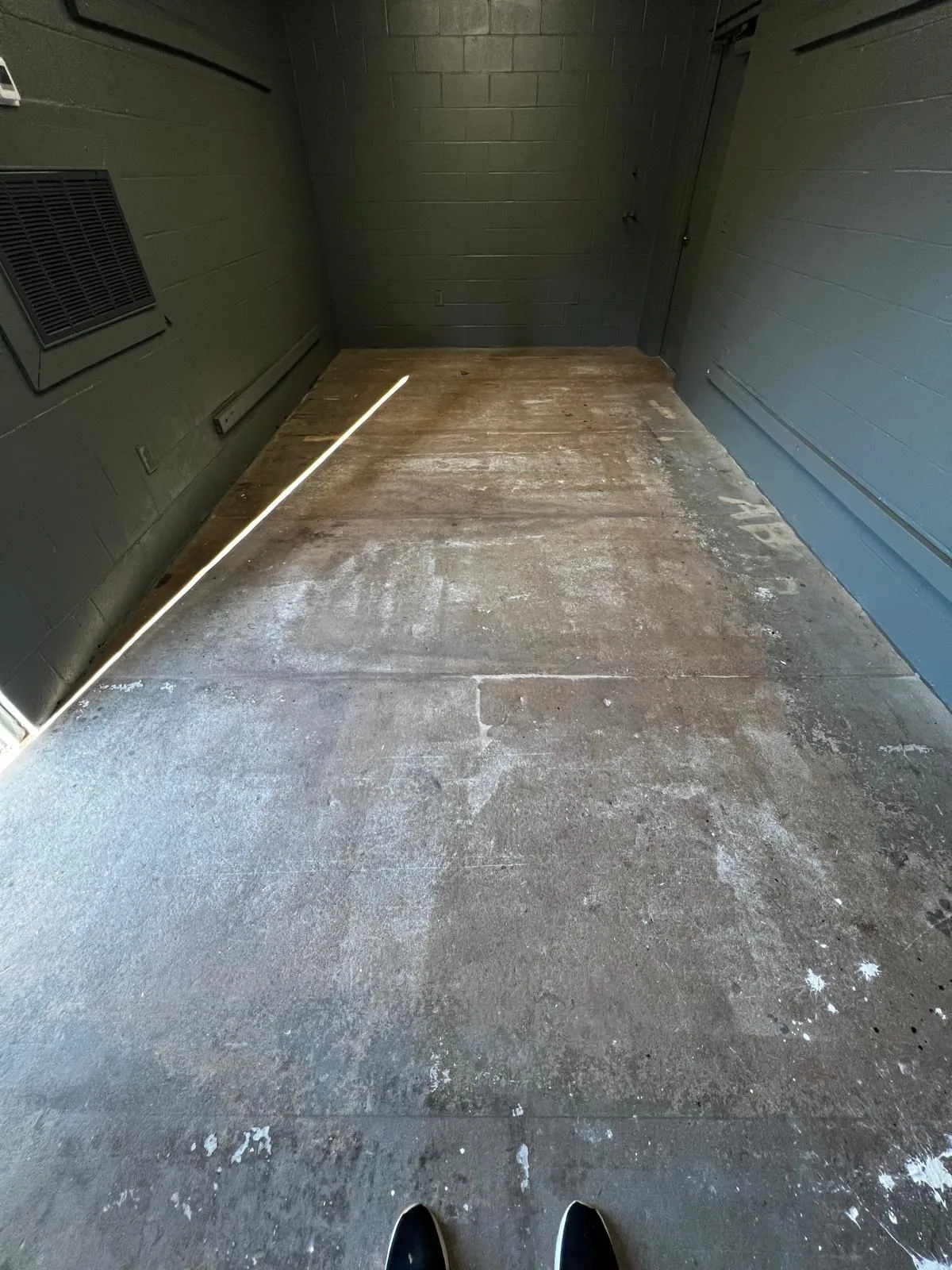 Bare concrete subfloor cleaned and prepped before installation