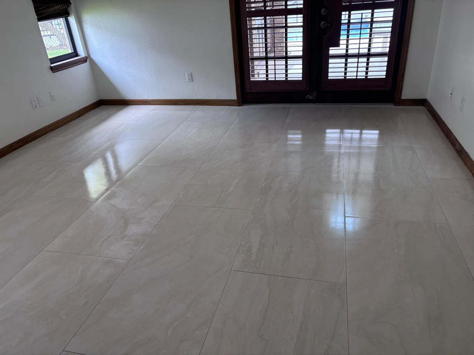 Large format porcelain tile across a bright living room